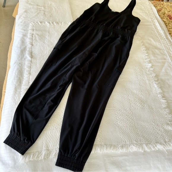 Athleta Unbound Black Jumpsuit Sleeveless Drawstring Waist Pockets size Large - Picture 7 of 15